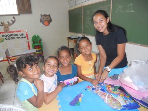 The 5 year old girls making a mother's day craft with their teacher Ada who is one of our seminary girls
