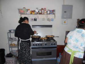 Our wonderful cooks preparing fried chicken to sell for 3 tickets! 