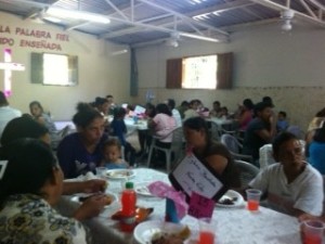 The crowd enjoying the meal and the fellowship!