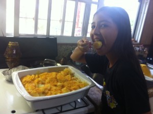 Brooklyn enjoying her birthday meal and favorite food:  Cheesy Potatoes!