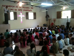 Pastor Hodges preaching to the children on Children's Sunday.  Can you find him?