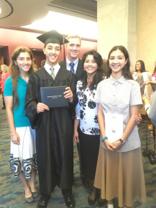 He reconvened with his family after graduation for the picture-taking festivities!